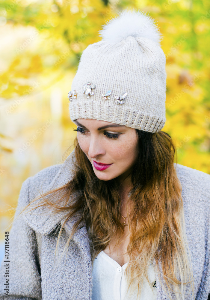 The beautiful woman walks in the autumn park The beautiful woman walks in the autumn park
