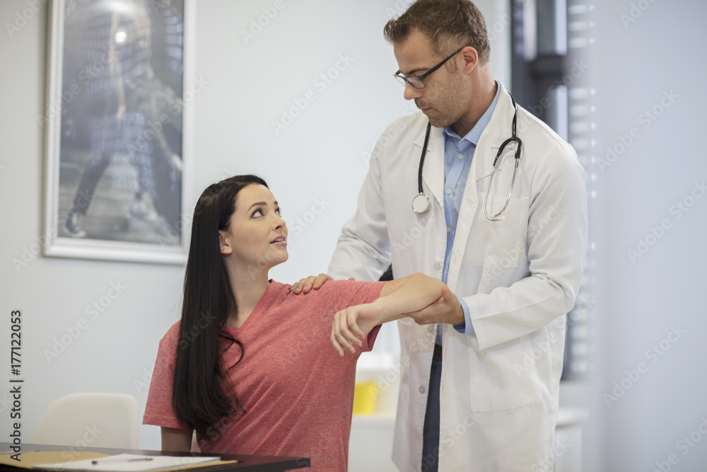 Doctor examining patient in medical practice Doctor examining patient in medical practice