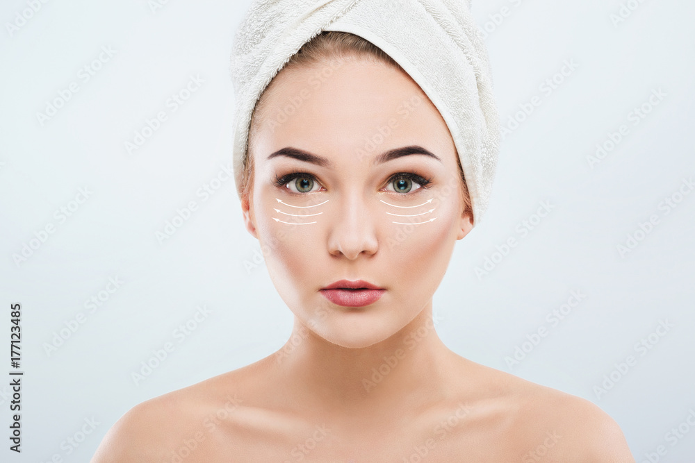 Beautiful girl with naked shoulders and white towel on hair Beautiful girl with naked shoulders and white towel on hair
