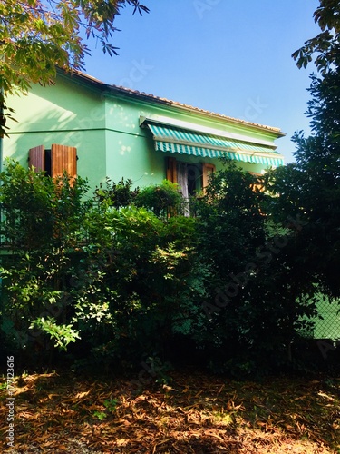 Green house and red leaves (Fano, Italy) photo