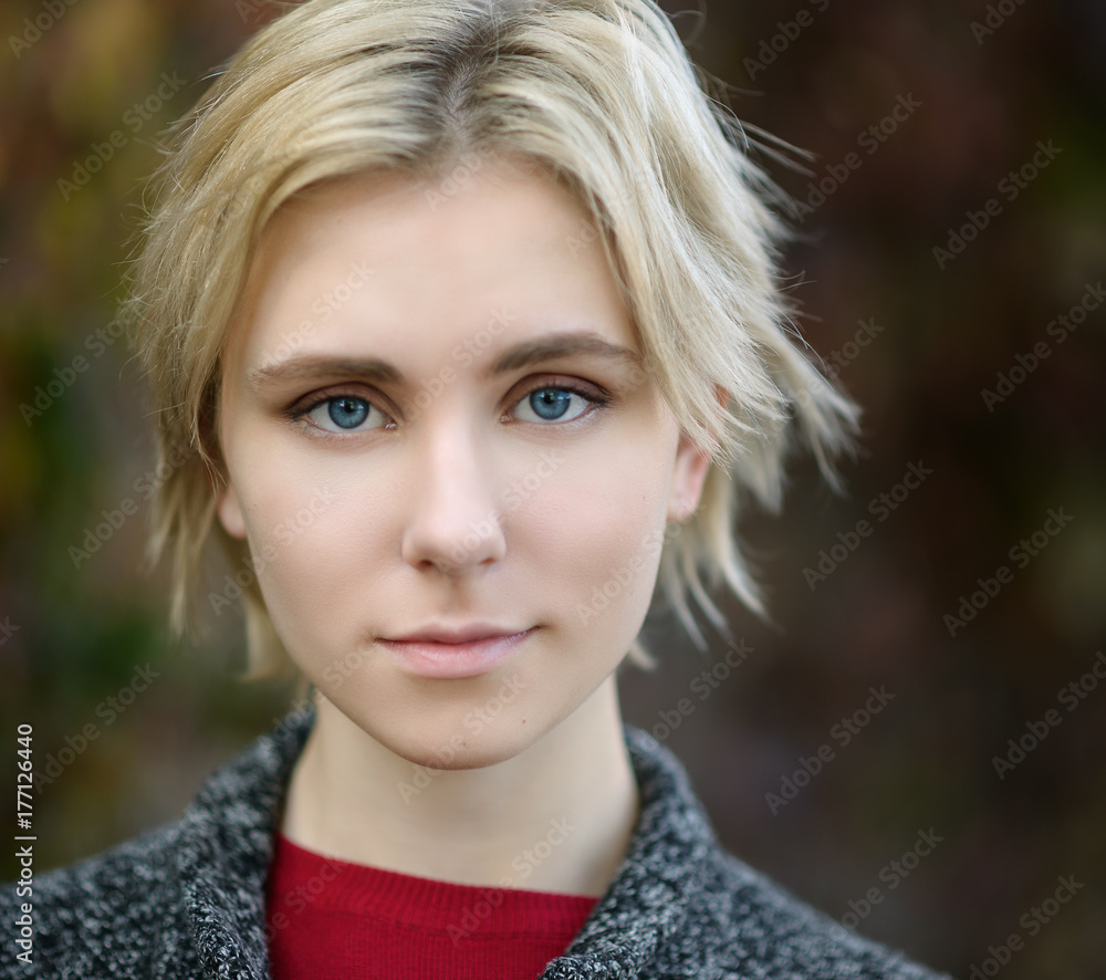 Outdoors portrait of beautiful young woman. Selective focus. Outdoors portrait of beautiful young woman. Selective focus.