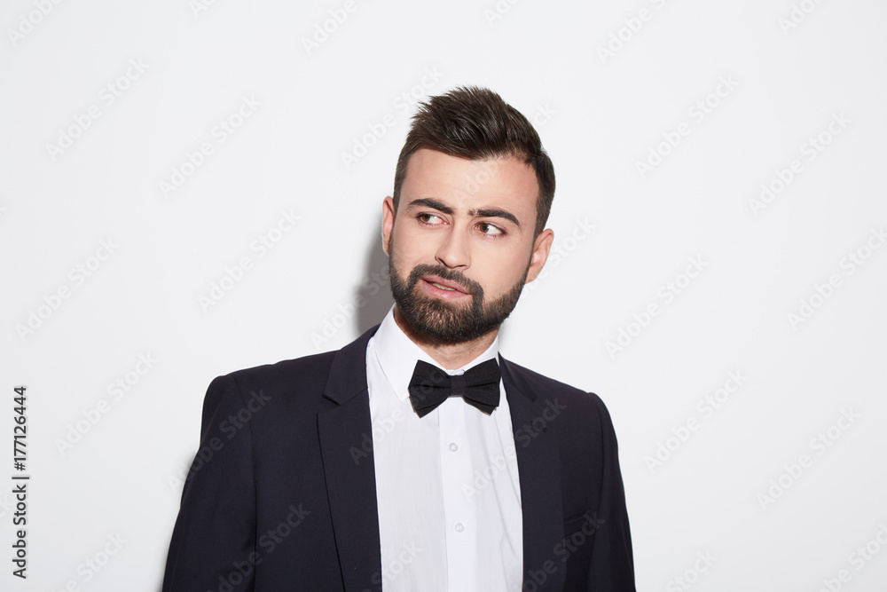 Attractive man at white background in suit Attractive man at white background in suit