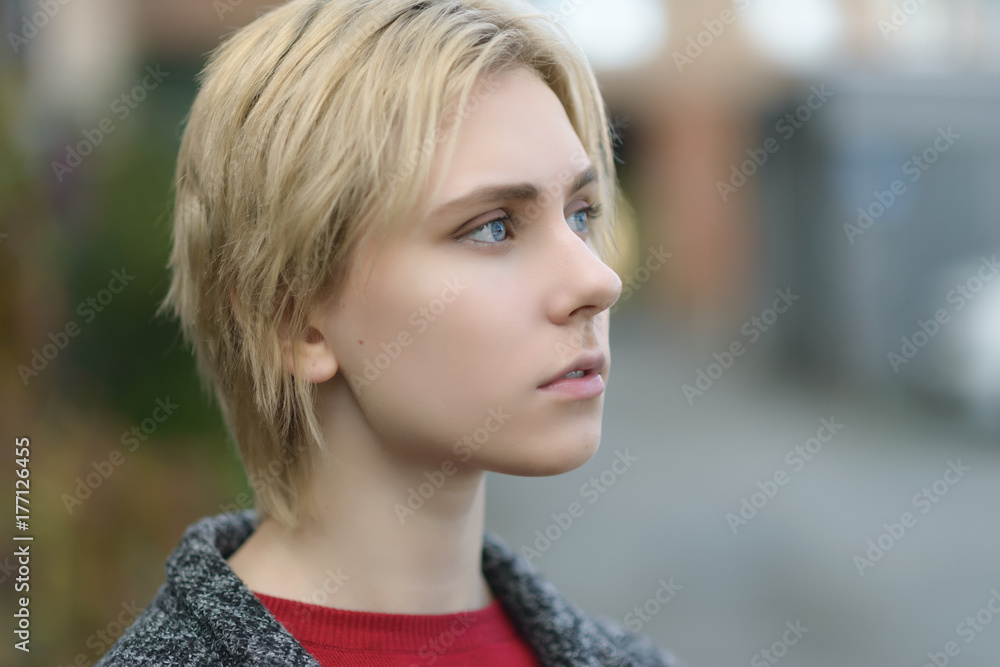 Outdoors portrait of beautiful young woman. Selective focus. Outdoors portrait of beautiful young woman. Selective focus.