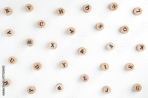 Background from the letters of the English alphabet on wooden cylinders. Stamps. Background for your text and design 