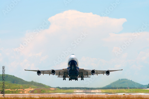 Airplane take off above airport runway
