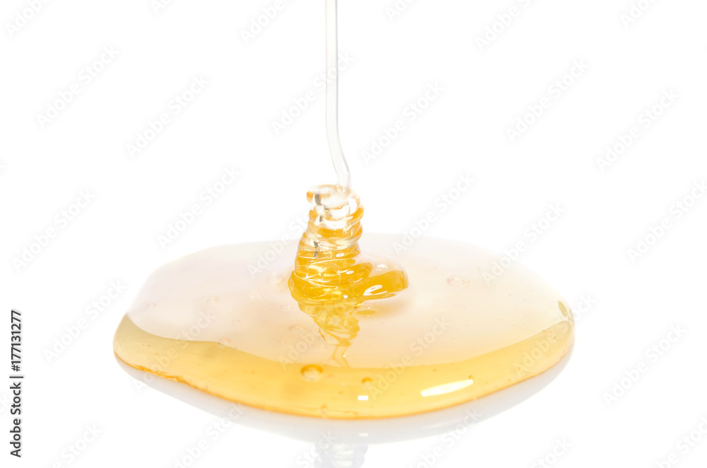 pouring honey on white background pouring honey on white background