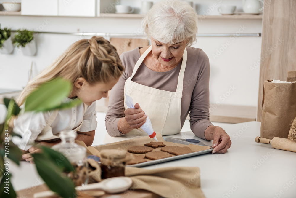 Friendly family preparing sweet pastry for special occasion Friendly family preparing sweet pastry for special occasion