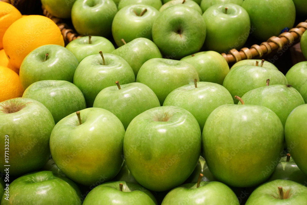 Variety of organic apples in baskets on wood table. Variety of organic apples in baskets on wood table.