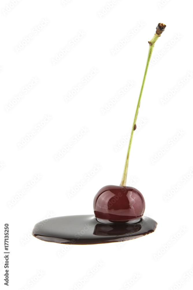 red cherry in black chocolate isolated on white background red cherry in black chocolate isolated on white background
