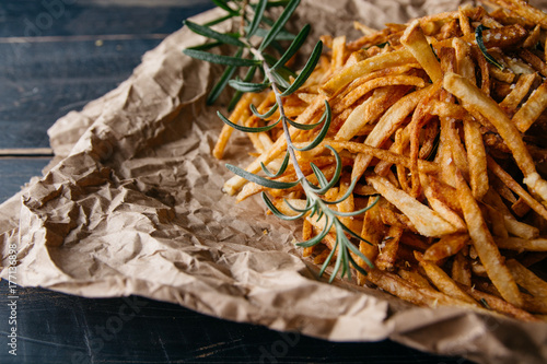 Shoestring fries with a rosemary sprig