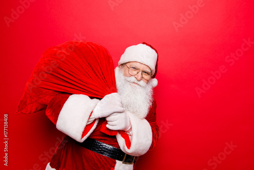 Holly jolly x mas festive noel miracles and magic time! Funny santa in headwear, costume, black belt, white gloves brings a lot of gifts for kids, ready, prepared, sale promotion concept photo