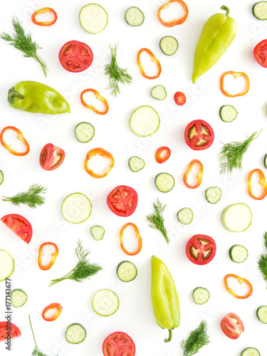 Fototapeta Naklejka Na Ścianę i Meble -  Composition of fresh vegetables. Tomatoes slices, red and green peppers, dill, isolated on white background. Top view, flat lay. Wallpaper of a vegetable pattern.
