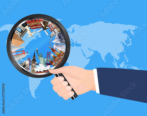 travel landmark in magnifying glass on world map