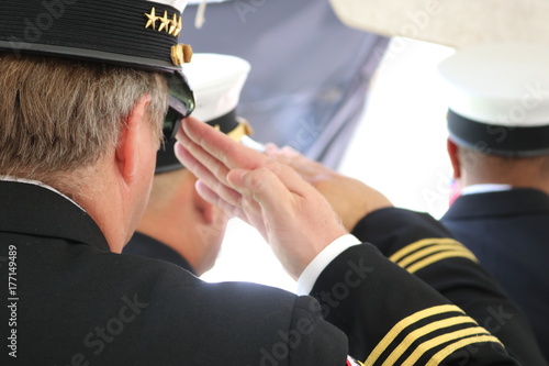 a military man saluting the flag