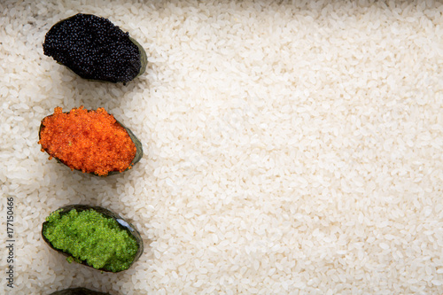 Top view on sushi gunkan on white rice background and texture copy space