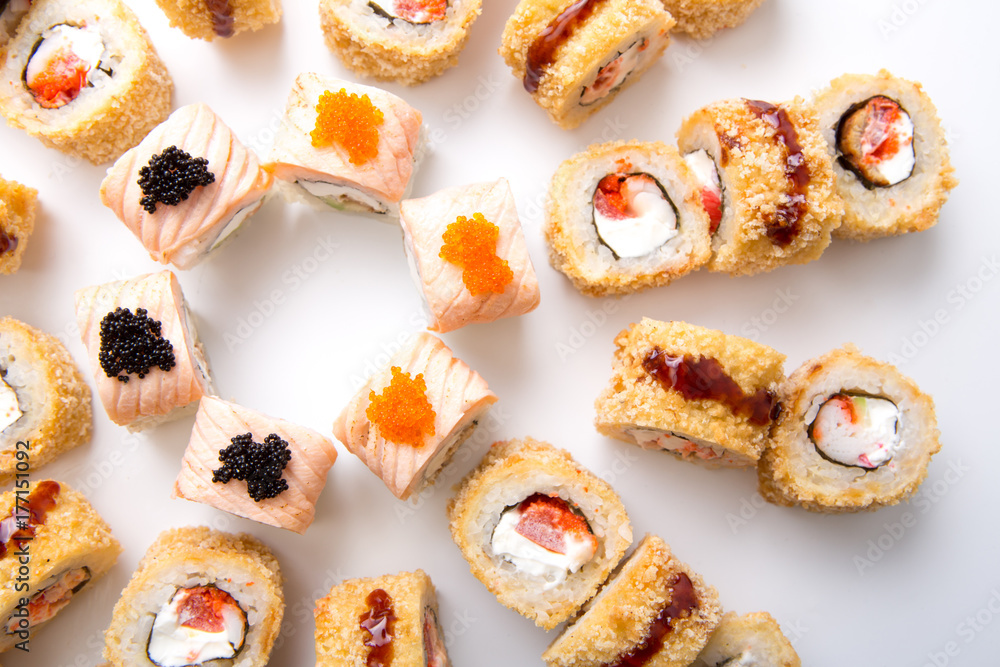 Top view on japanese sushi rolls,maki on white background