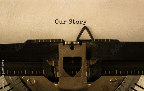 Text Our Story typed on retro typewriter photo