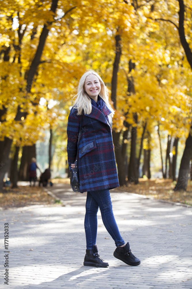 Portrait of a young beautiful woman in blue coat Portrait of a young beautiful woman in blue coat