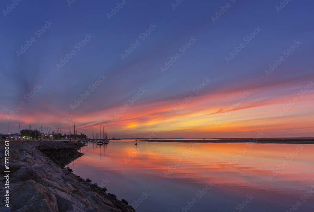Dawn seascape view of Olhao Marina, waterfront to Ria Formosa natural park. Algarve.
