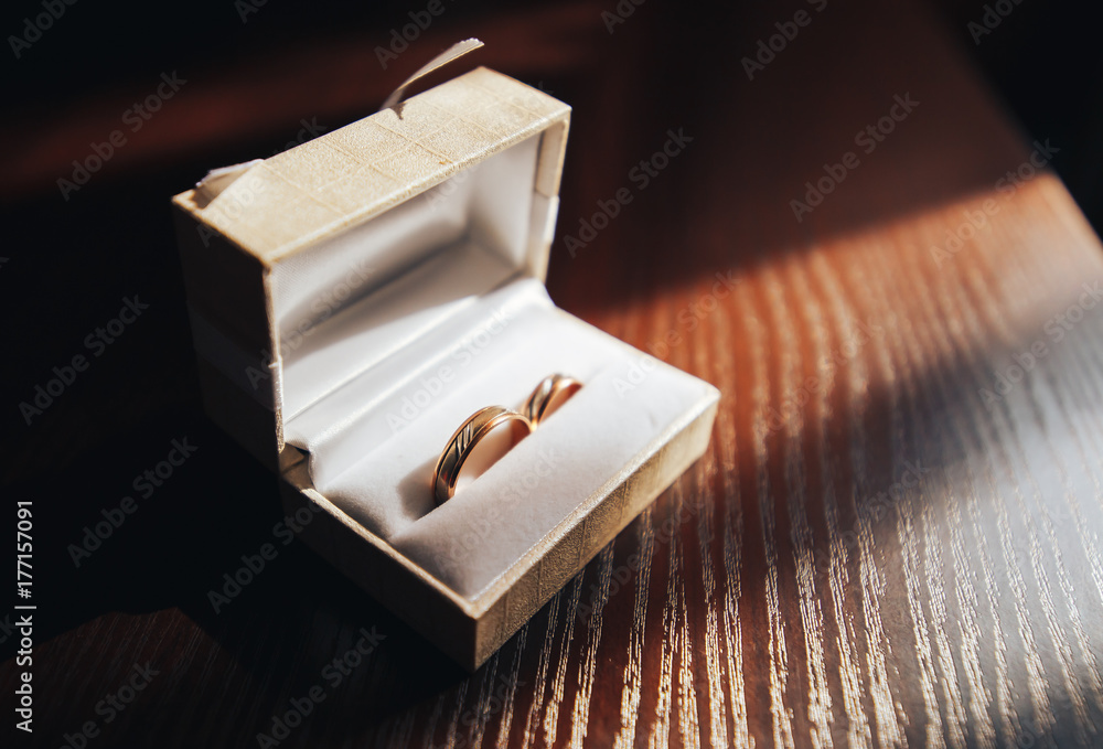 two gold wedding rings in a paper package two gold wedding rings in a paper package