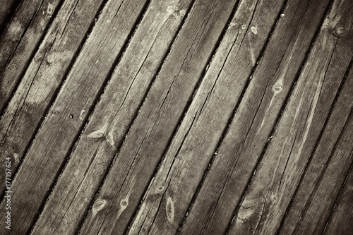 Close up shot to a textured dark wooden fence