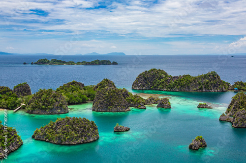 Pianemo Islands, Blue Lagoon with Green Rockes, Raja Ampat, West Papua. Indonesia