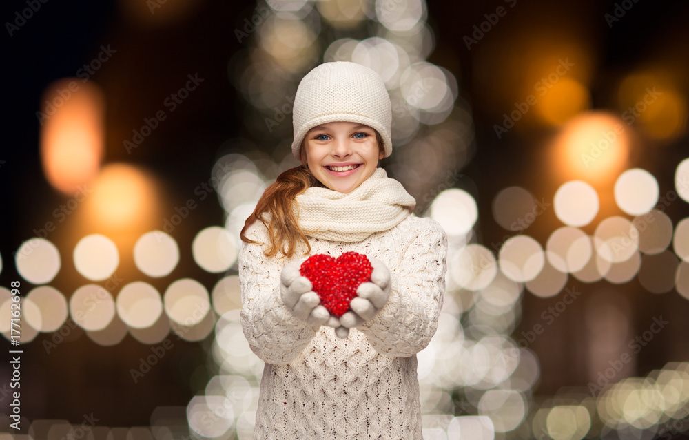 happy girl in winter clothes with red heart happy girl in winter clothes with red heart