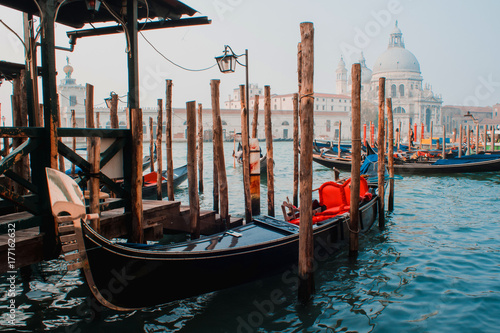 Cathedral of Santa Maria della Salute and gondola in the foreground in Venice, Italy © Ulia Koltyrina