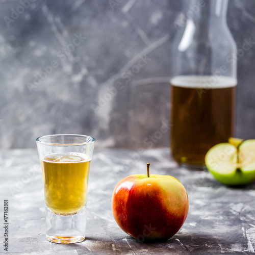 Apple cider drink in a bottle. Selective focus, space for text. 
