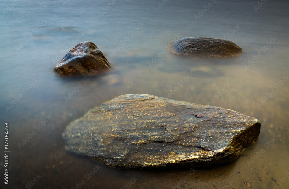 Rock bottom in the clear water of the sea. Soft focus Rock bottom in the clear water of the sea. Soft focus