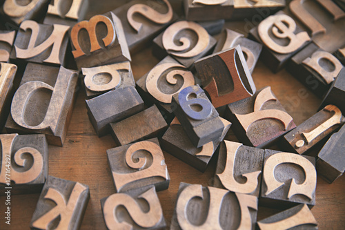 collection of old wooden printers lettering blocks for sale at a vintage flea market photo