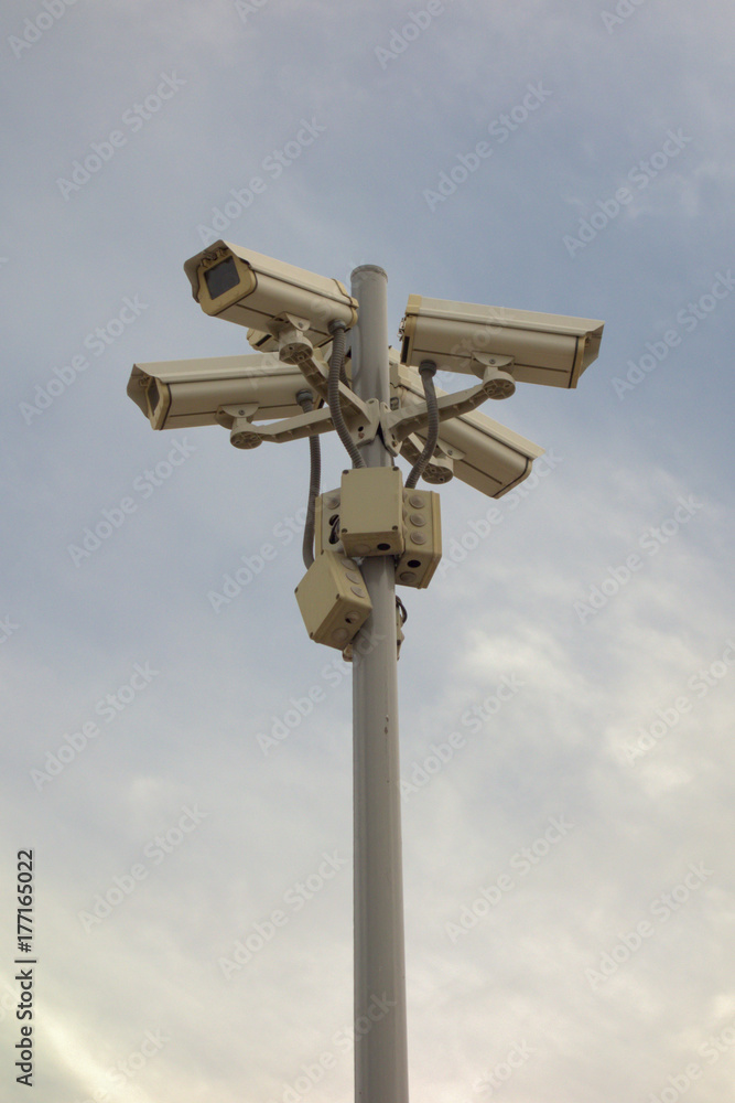 4 surveillance cameras on a pole 4 surveillance cameras on a pole
