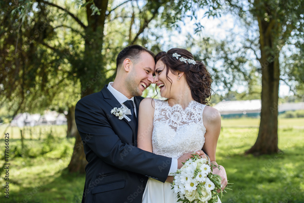 Portrait of a young couple. Wedding photo outdoor of loving couple Portrait of a young couple. Wedding photo outdoor of loving couple