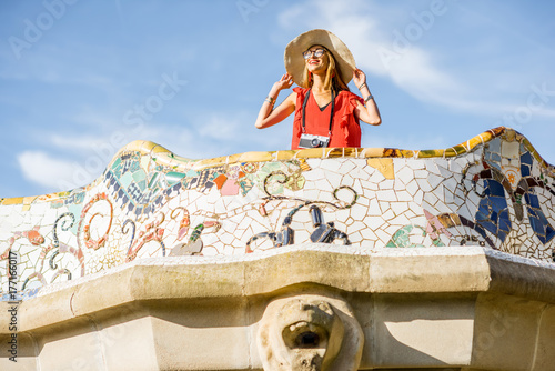 Photography View on the beautiful terrace decorated with mosaic with happy woman tourist in