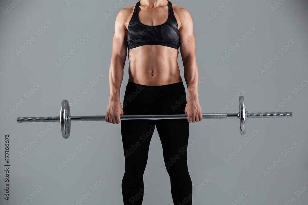 Cropped image of a strong muscular adult sportswoman Cropped image of a strong muscular adult sportswoman