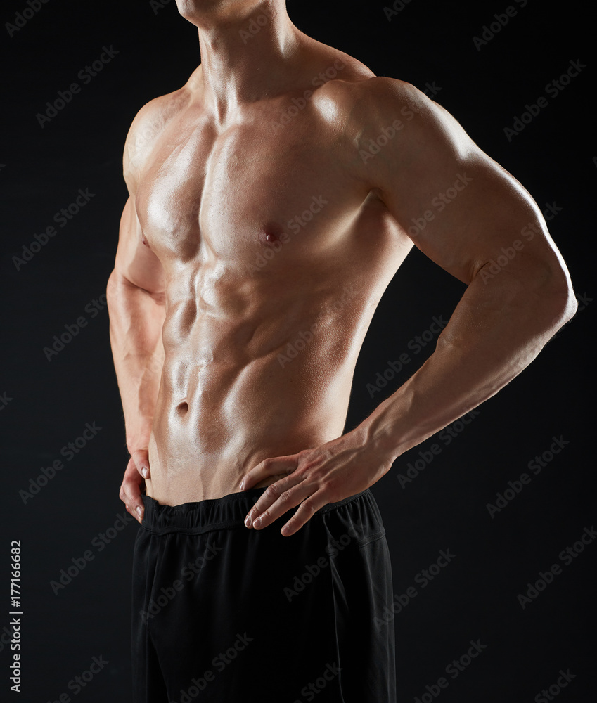 close up of man or bodybuilder with bare torso