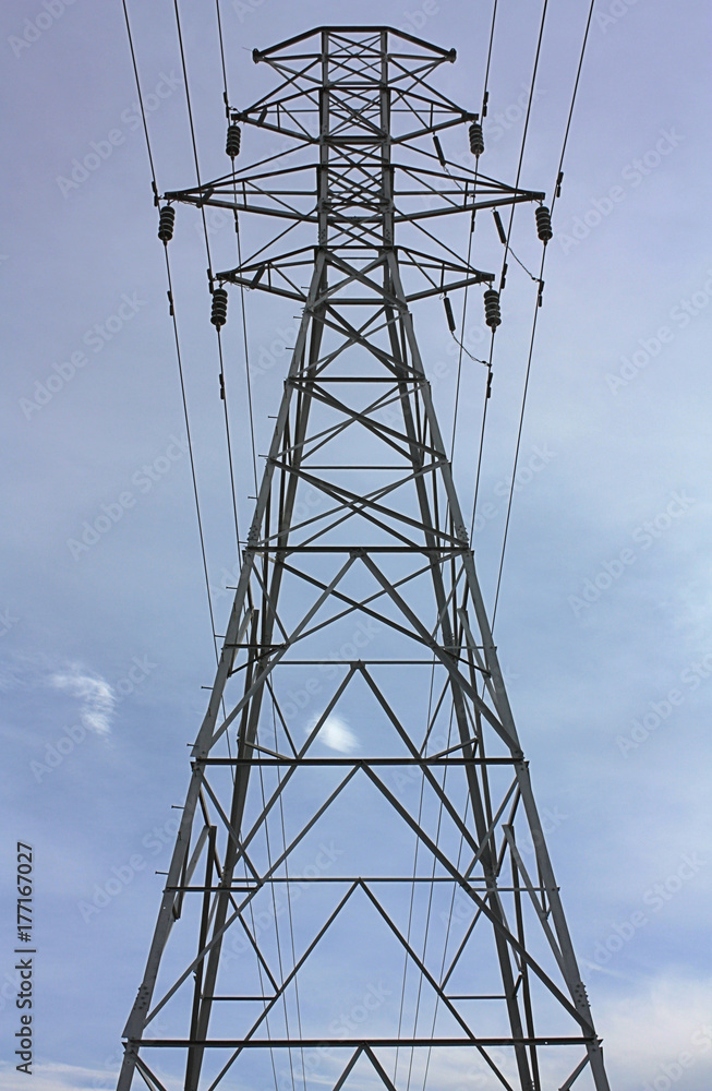 Transmission Tower (Electricity Pylon) with cloudy sky in background. Transmission Tower (Electricity Pylon) with cloudy sky in background.