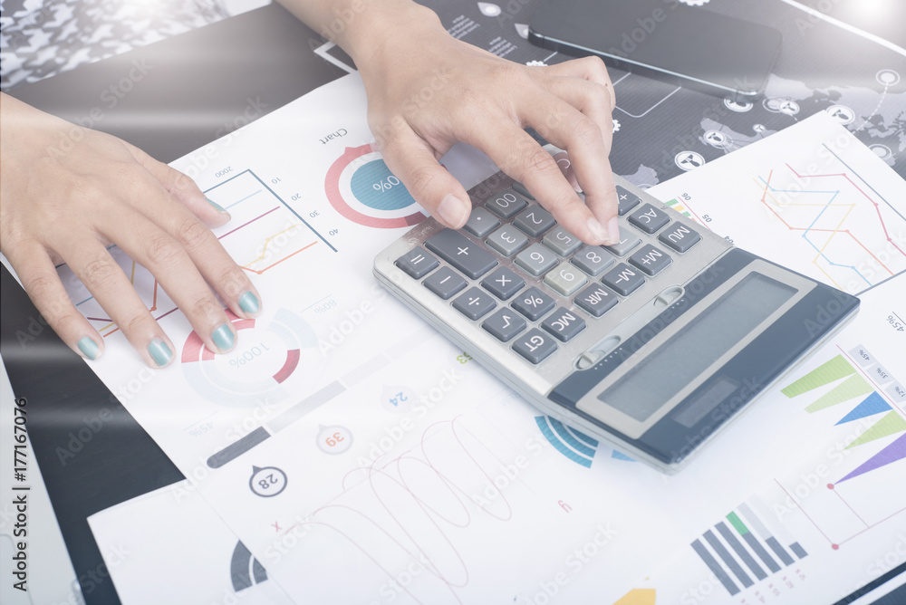 business accountant with document graph making calculations financial. concept planning budget and audit. business accountant with document graph making calculations financial. concept planning budget and audit.