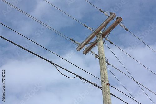 Telephone Pole with Cloudy Sky in background.
