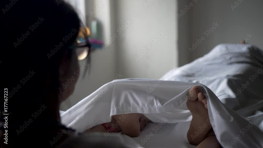 A female polarity therapist starts a session by feeling the energy in her client’s feet. Client is a mature caucasian woman. A female polarity therapist starts a session by feeling the energy in her client’s feet. Client is a mature caucasian woman.