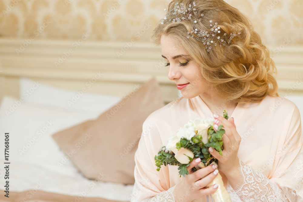 Beautiful young Bride with blonde hairs in a bedroom. Classic white wedding dress. Half-length portrait Beautiful young Bride with blonde hairs in a bedroom. Classic white wedding dress. Half-length portrait