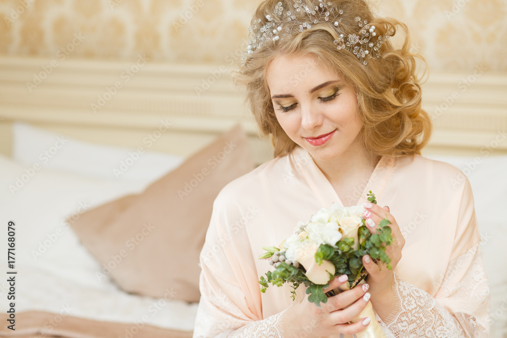 Beautiful young Bride with blonde hairs in a bedroom. Classic white wedding dress. Half-length portrait Beautiful young Bride with blonde hairs in a bedroom. Classic white wedding dress. Half-length portrait