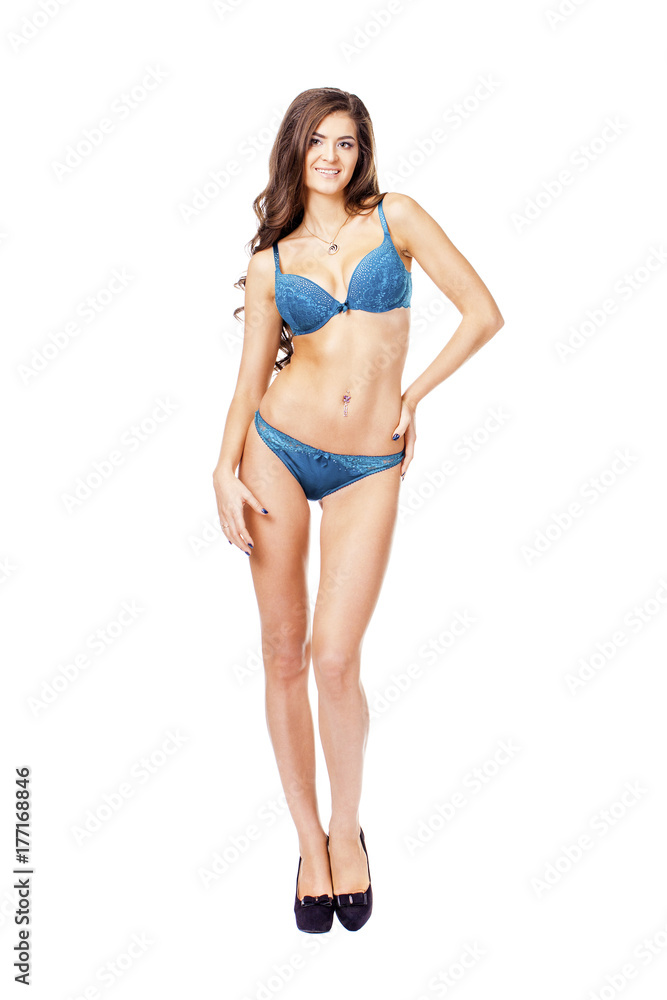 Full length beautiful slim tanned woman in bikini, isolated on white background Full length beautiful slim tanned woman in bikini, isolated on white background