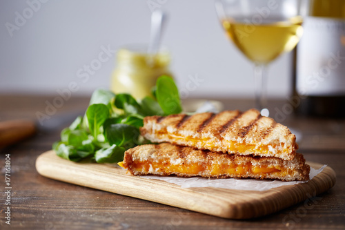 Grilled cheese sandwich on cutting board photo
