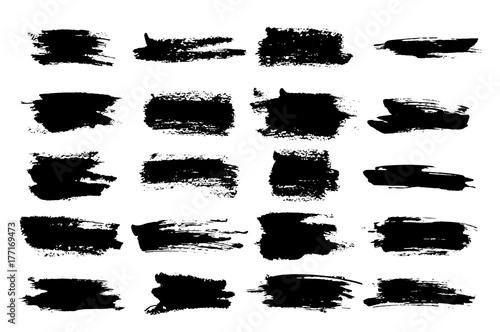 Horizontal black ink scratches or brush watercolor