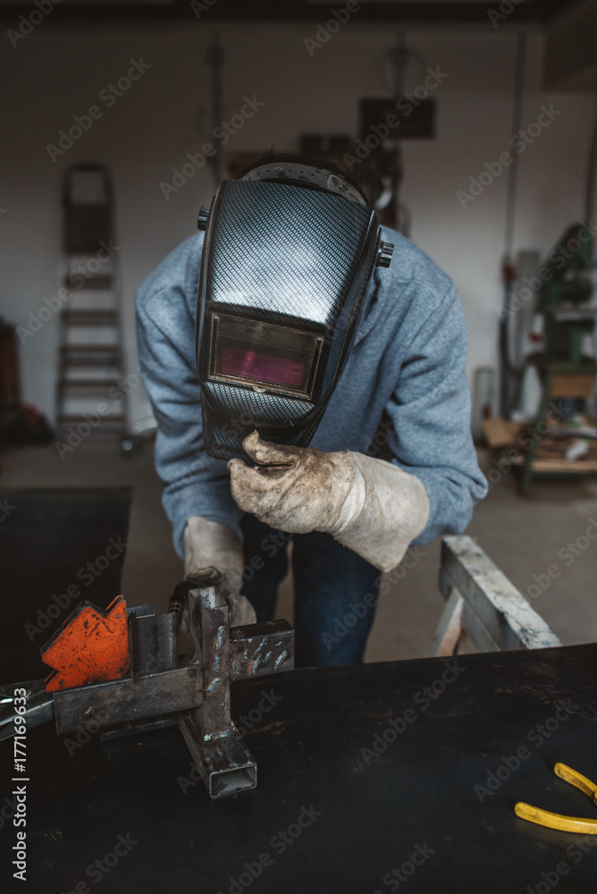 Welder working in the workshop Welder working in the workshop
