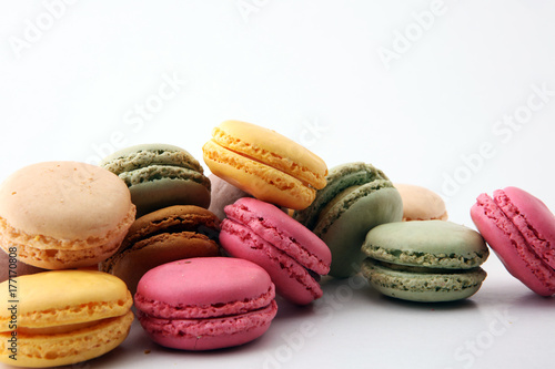 Sweet and colourful french macaroons or macaron on white background, Dessert © beats_