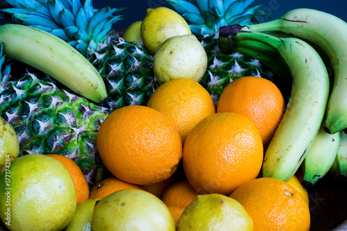 Fresh fruits banana oranges lemon pineapple . Set of different fresh fruits photo