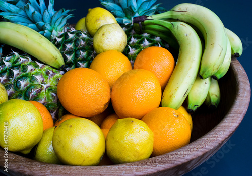 Fresh fruits banana oranges lemon pineapple . Set of different fresh fruits photo