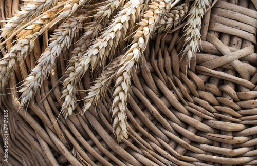 wheat flakes on the background of a wicker basket